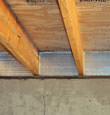 SilverGlo™ insulation installed in a floor joist in Suffern