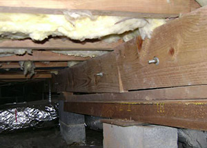 sagging crawl space with wooden shimming a Saugerties crawl space