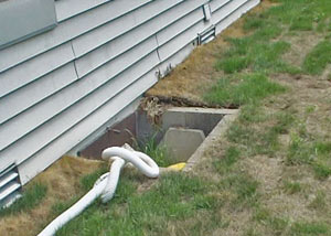 old concrete window well of a Newburgh crawl space