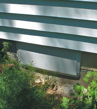 A gray crawl space vent cover in Warwick