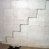 A diagonal stair step crack along the foundation wall of a New Paltz home