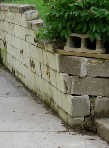 collapsing retaining wall with severe damage in Port Jervis