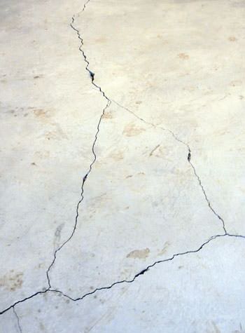 severely cracked, heaving slab floors in a home in Stony Point