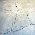 foundation heaving cracks in a slab floor in Monroe