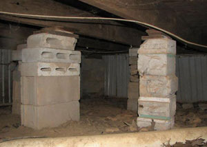 crawl space repairs done with concrete cinder blocks and wood shims in a New Paltz home