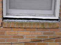A window sill cracking and separating from the foundation wall in a Fishkill home.