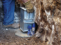 Securing a foundation footing bracket for a foundation repair system in Hopewell Junction.