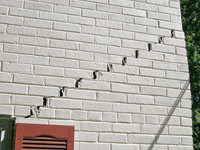 Stair-step cracks showing in a home foundation in Wallkill