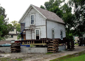 A severely damaged home foundation that is undergoing replacement in Highland.