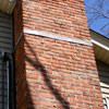 A tilting chimney on a Monticello home with a leaning, tilting chimney that was temporarily repaired.