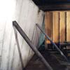 Temporary foundation wall supports stabilizing a Monroe home