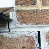 Failed crack repair showing old tuckpointing that cracked on a Newburgh home.