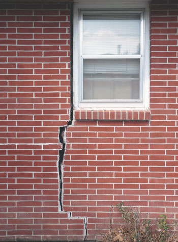 severe foundation wall cracks along a window in Highland