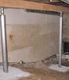 A system of crawl space support posts adding structural support to a crawl space in Goshen