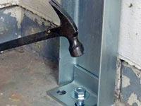 Mounting a foundation channel anchor installation to the floor in Wappingers Falls.