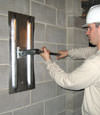 Tightening a wall anchor plate in Monroe, New York