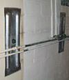 Foundation wall anchor plates installed in a basement in Newburgh