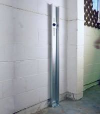 A failing foundation wall repaired with a foundation wall channel anchor system in a Monroe home.