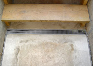 Our grated drain system installed on a leaking basement staircase in Red Hook.