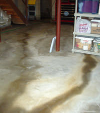 Flooding entering a basement through a floor crack in Pearl River