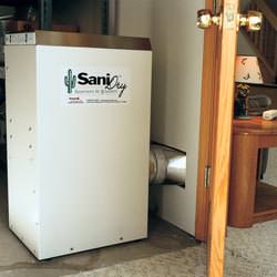 A basement dehumidifier with an ENERGY STAR® rating ducting dry air into a finished area of the basement  in Goshen