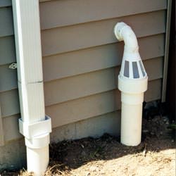 A grated sump pump discharge line fitting in Wallkill
