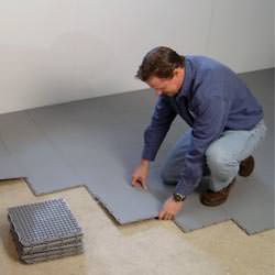 basement subfloor tiles being installed by a contractor in Stony Point