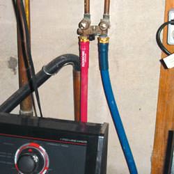 Washer hoses in a basement  in Monticello