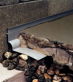 a custom designed basement drain system for thin basement floors in Highland.