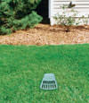 A buried gutter drain downspout extension installed in a Goshen home