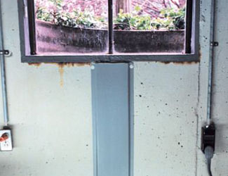 Repaired waterproofed basement window leak in Monroe